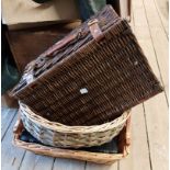 Two wicker baskets, a wicket picnic case and a leather case