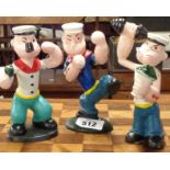 Three modern painted cast iron Popeye figurines