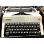 A vintage Olympia portable typewriter in original fitted case