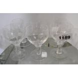 A set of six Stewart Crystal sherry glasses with swag and leaf cut decoration