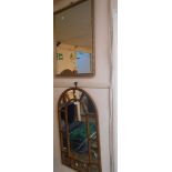 A gilt framed oblong wall mirror - sold with a modern arched wall mirror with plastic frame