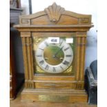 An early 20th Century oak cased mantel clock with decorative dial and HAC eight day striking