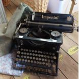 A 1920's Imperial typewriter with original canvas cover