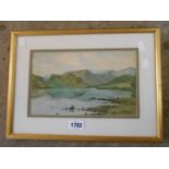 T. Sparks: a gilt framed watercolour, depicting a mountain lake landscape - signed and dated 1931