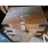 A vintage iron bound mixed wood tuck box with name C.O.S. Hatton to lid and flanking drop handles