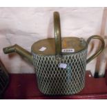 An antique brass hot water jug of watering can form