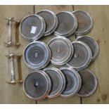 A box containing a set of twelve silver plated wine coasters with turned oak centres and a pair of
