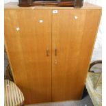 An 89cm retro Staples Ladderax teak effect two door wardrobe unit with pull-out hanging rail