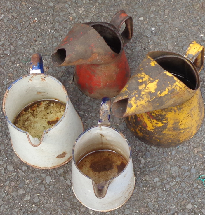 Two vintage oil cans - sold with two enamel jugs