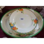 A Losolware meat platter decorated with a transfer printed and hand painted lily pattern design -