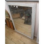 A painted wood framed bevelled oblong wall mirror