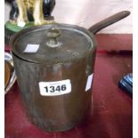 A Victorian copper saucepan and lid with cast iron handles