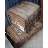 Two vintage canvas trunks with applied luggage labels for the Elder Dempster Line