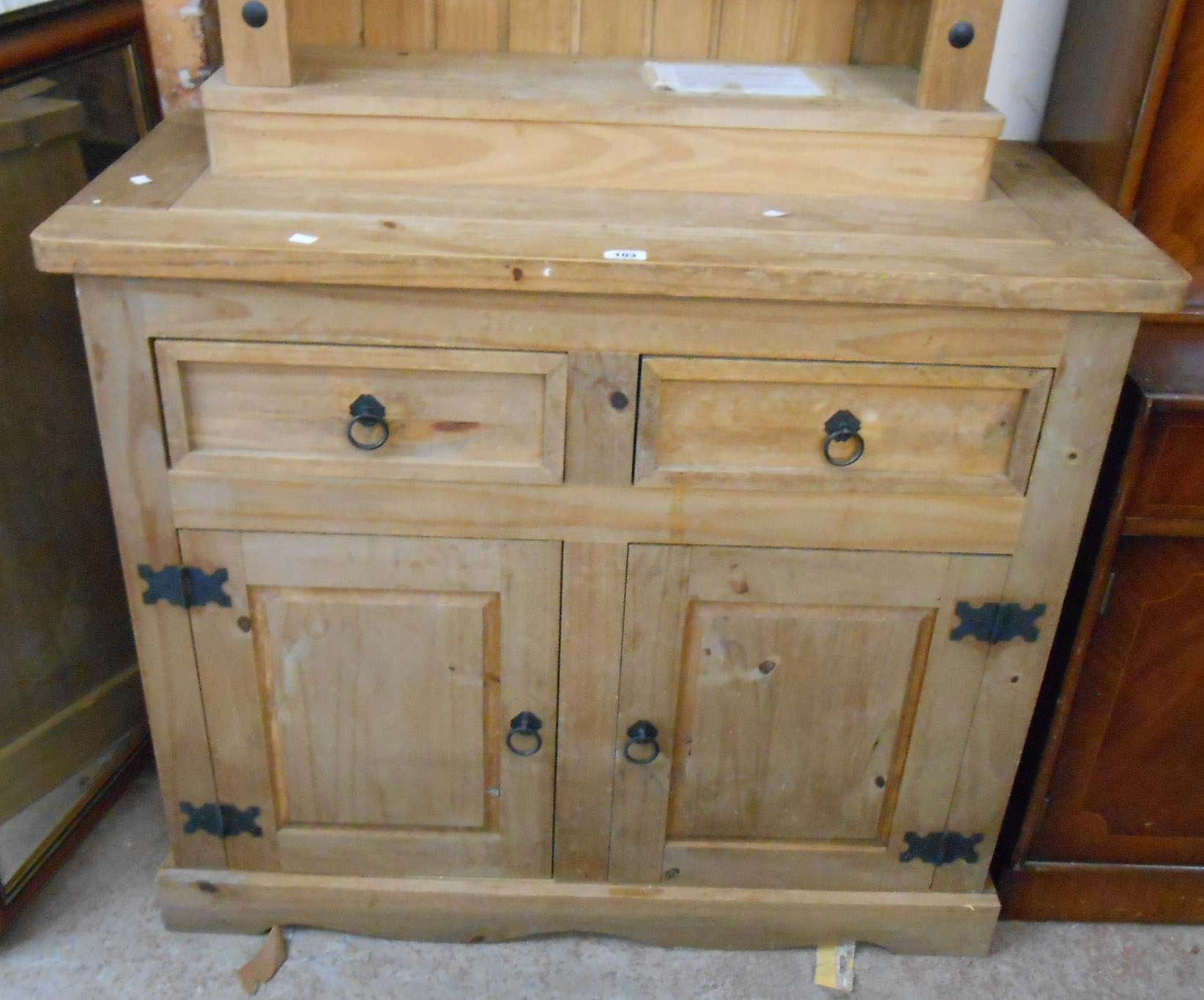 A 1.07m modern pine dresser base with two short drawers over a pair of panelled cupboard doors