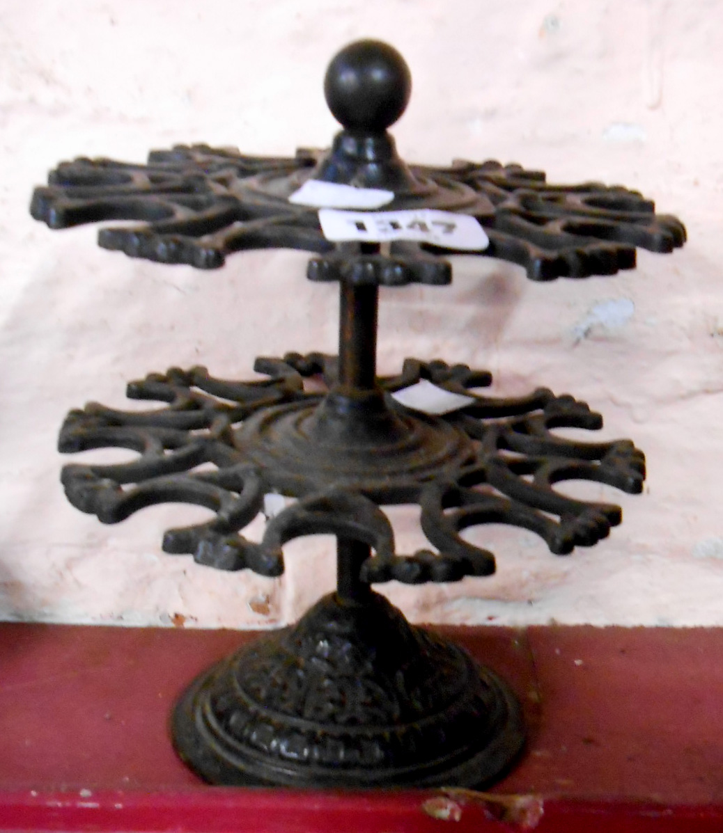 An old cast iron two tier desk stamp carousel