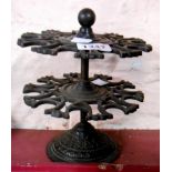 An old cast iron two tier desk stamp carousel
