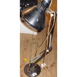 A vintage anglepoise lamp with black painted finish