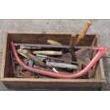 A wooden crate containing a quantity of assorted hand tools including hammers, hand drill, etc.