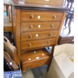 A 55.5cm Edwardian mahogany and strung music chest with four long drop-front drawers and