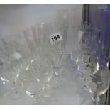 A quantity of assorted glassware including cut crystal champagne flutes, etc.