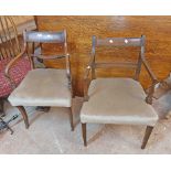 A pair of 19th Century mahogany framed rope back elbow chairs with overstuffed upholstered seats,