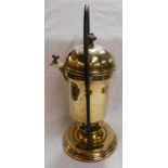 An antique brass spirit burner coffee percolator of swing form with wrought iron loop stand and
