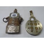 Two Eastern powder flasks comprising one horn with silvered and brass mounts and cast iron rings,