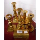 A pair of Victorian brass candlesticks - sold with two further similar, a later chamberstick and a