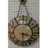 A vintage decorative pendant wall timepiece with brassed metal Zodiac motif border and later battery