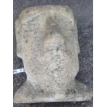 A concrete Easter Island style head