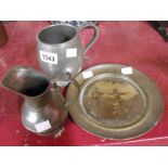 A pewter tankard with glass dartboard base, a Britannia metal jug and a decorative brass dish