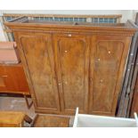 A 1.98m Victorian mahogany triple wardrobe with moulded cornice, hanging space, linen slides and