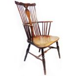 A Georgian comb back country elbow chair with moulded solid elm seat, set on turned supports - old