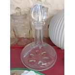 An Orrefors Swedish Art Glass decanter of ship's form with dimple base and lobed stopper