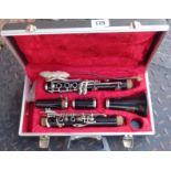 A vintage Boosey & Hawkes Regent clarinet in original case with instruction book and original