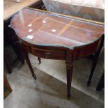 A 75cm reproduction yew wood break bow front side table with glass top and frieze drawers, set on