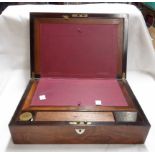 A Victorian rosewood veneered writing slope with fitted interior, inkwell and stamp holder