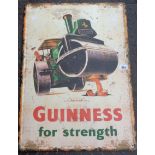 A modern printed tin Guinness for Strength advertising sign