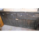 A 2.15m late Victorian stained pine cabinet with two long frieze drawers over a pair of panelled