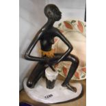 A vintage Anzengruber Keramic Austrian pottery figure of an African lady playing a drum - a/f