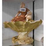 A 20th Century Royal Dux porcelain table centrepiece depicting a maiden pouring a water pot into a