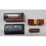 A Hohner miniature harmonica in original box - sold with a slightly larger similar - both boxes a/f