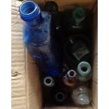 A box containing a quantity of old bottles including ink, poison, etc.