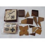 A bag containing a quantity of old wooden puzzles