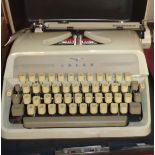 An Adler Junior 3 portable typewriter in original case