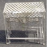 A nest of three painted wirework metal garden tables