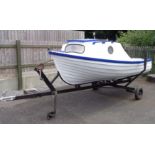 A simulated clinker fibreglass 12' open cabin day boat with launching trailer - sold with a pair