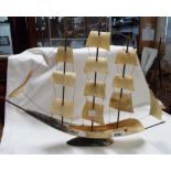 An old cow horn model of a sailing ship