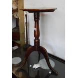 A stained mixed wood tilt-top pedestal table, set on tripod base - adapted