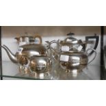 A silver plated three piece tea set with engraved presentation text to teapot - sold with a hot